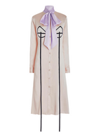 Long beige dress with a purple bow and black accents on a white background