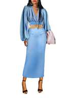 Woman wearing a blue dress with a white background