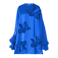 Blue dress with floral appliqués on a white background
