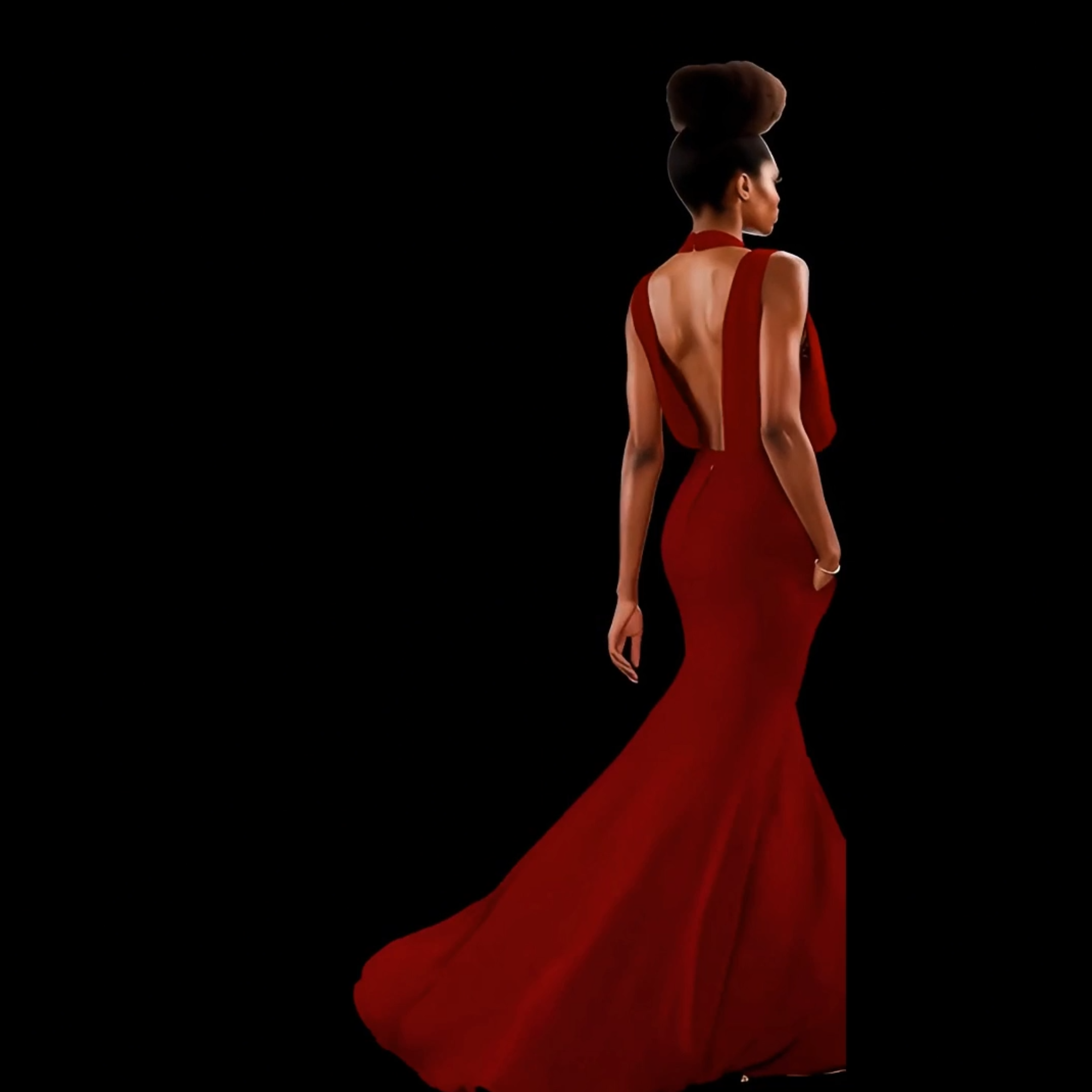 Woman in a red evening gown with a long train on a black background