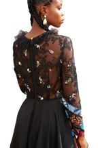 Model wearing a Maison Aria Dress