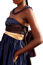 Model wearing a Maison Aria Dress