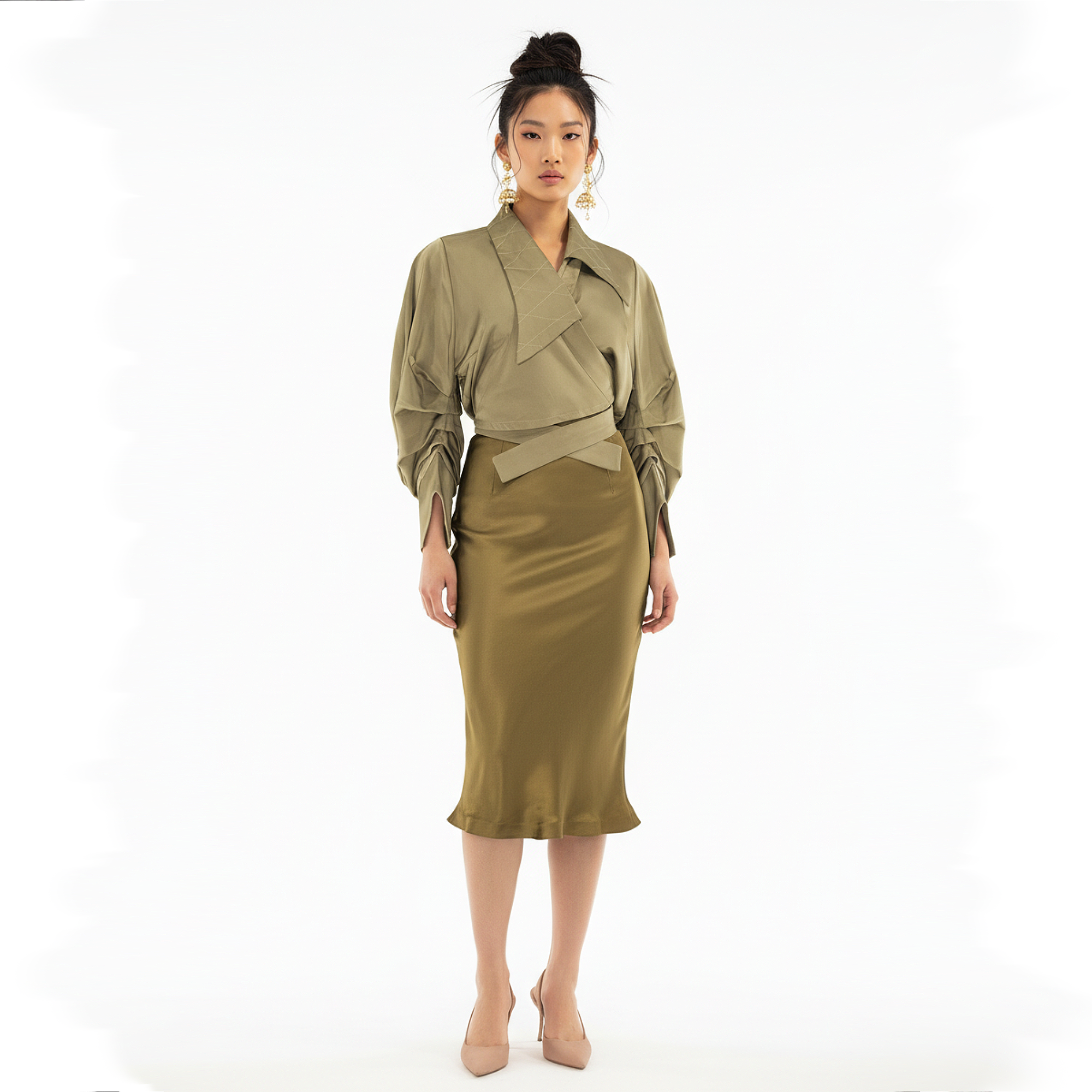 Woman wearing a green outfit on a white background