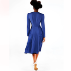 Blue dress worn by a model on a white background