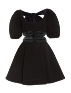 Model wearing a Maison Aria Dress