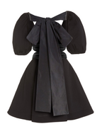 Model wearing a Maison Aria Dress