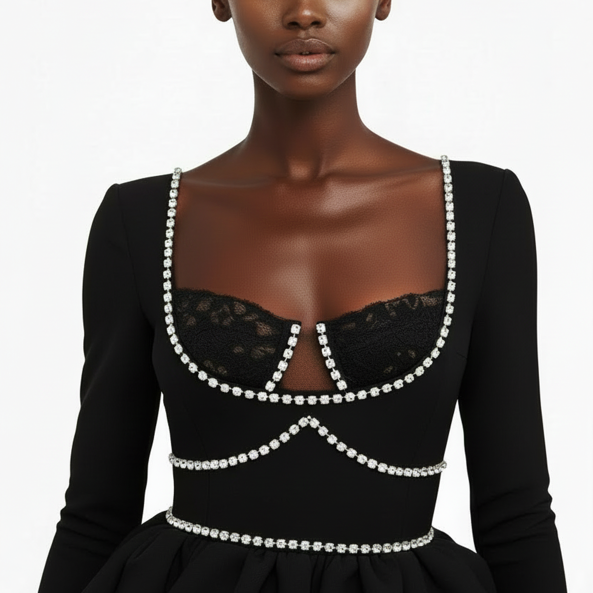 Black dress with lace and pearl details on a plain background