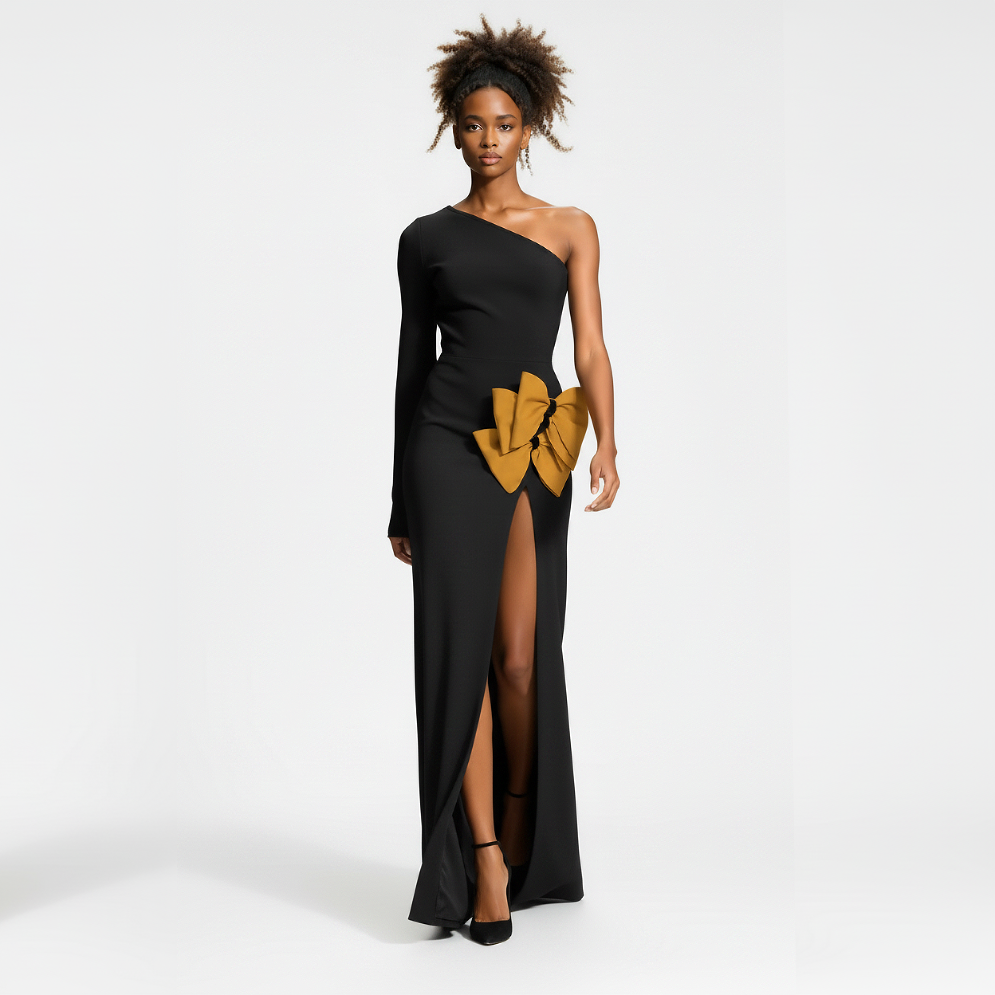 Black one-shoulder dress with a yellow bow detail on a white background