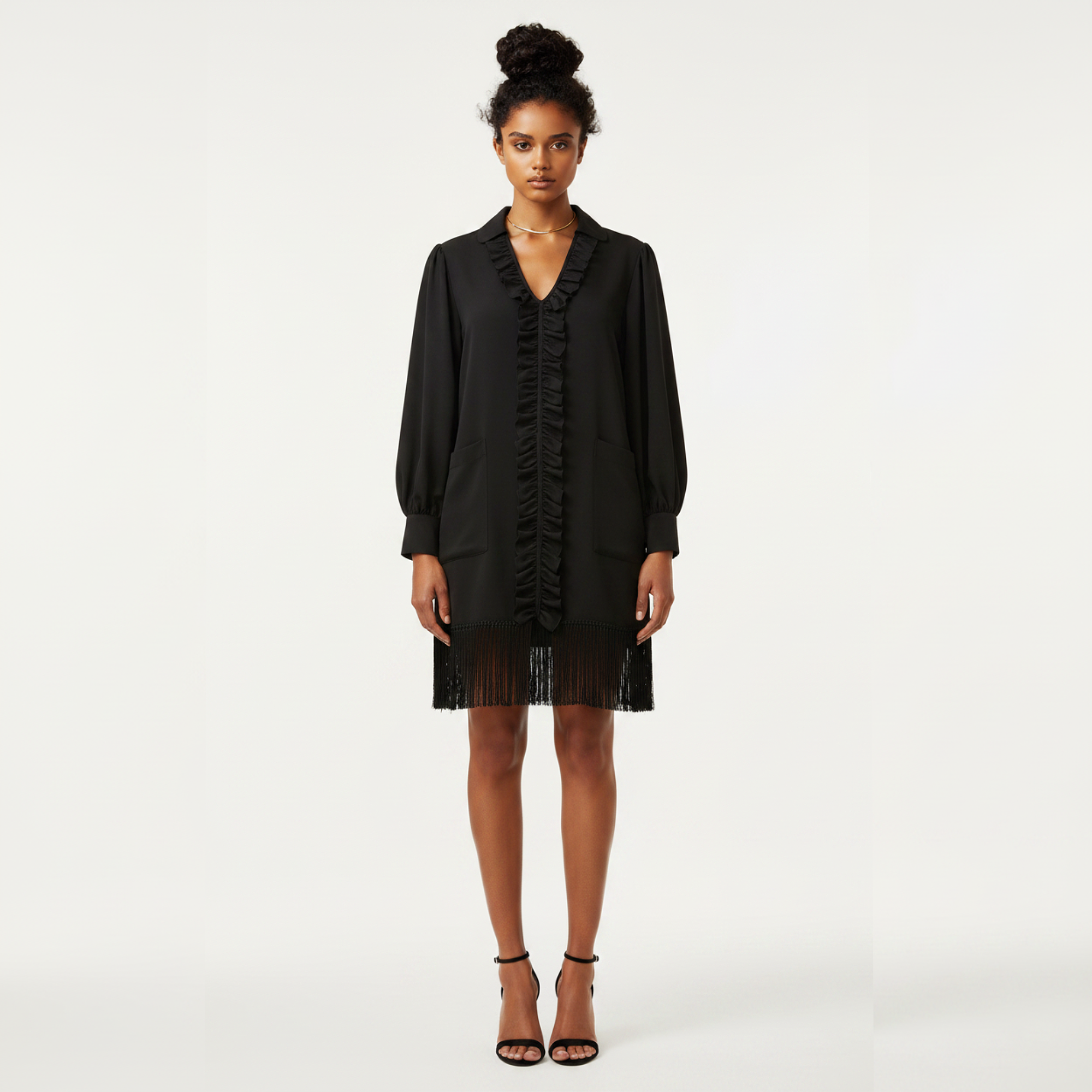 Woman wearing a black dress with a plain white background