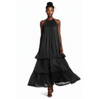 Black tiered dress worn by a model on a white background