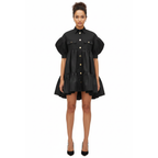 Woman wearing a black dress with puff sleeves on a white background