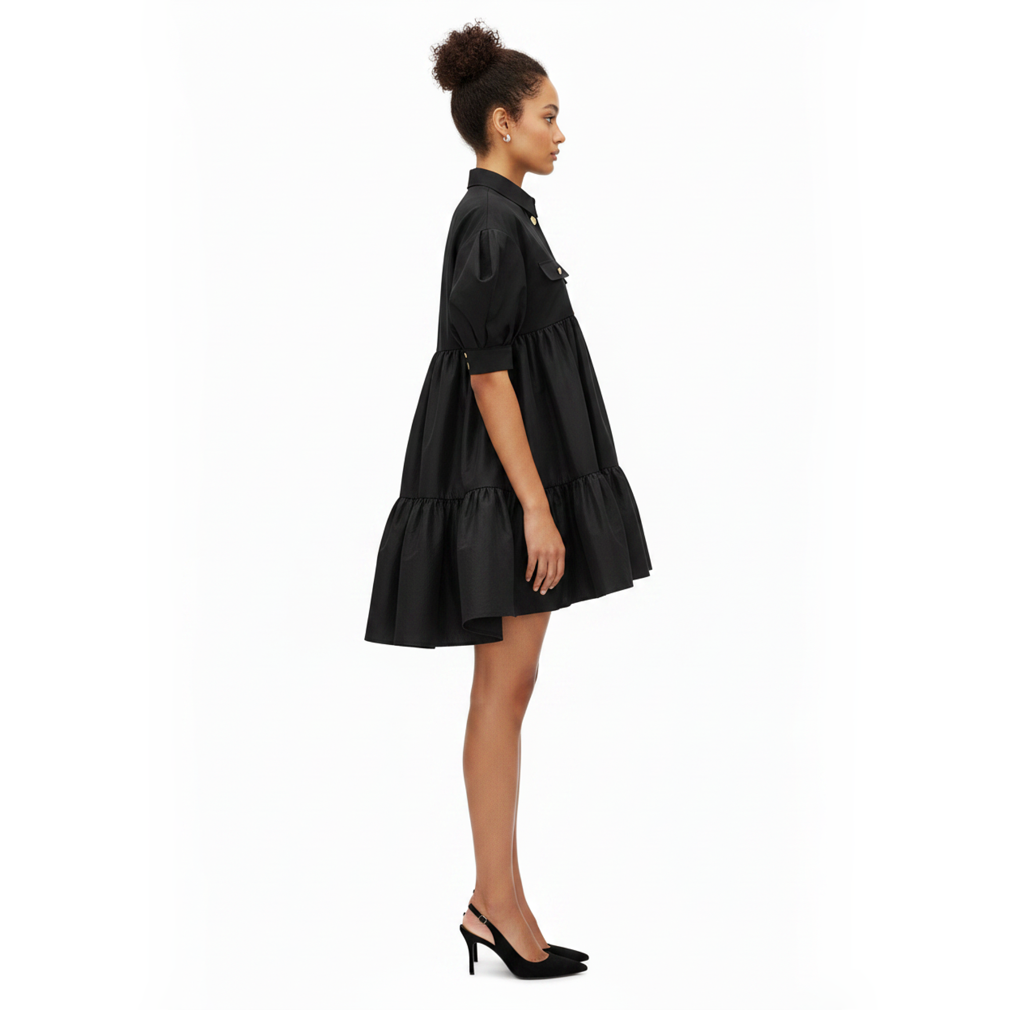 Woman wearing a black dress on a white background