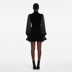 Black dress with long sleeves on a white background