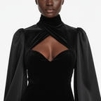 Black velvet dress with puffed sleeves on a white background