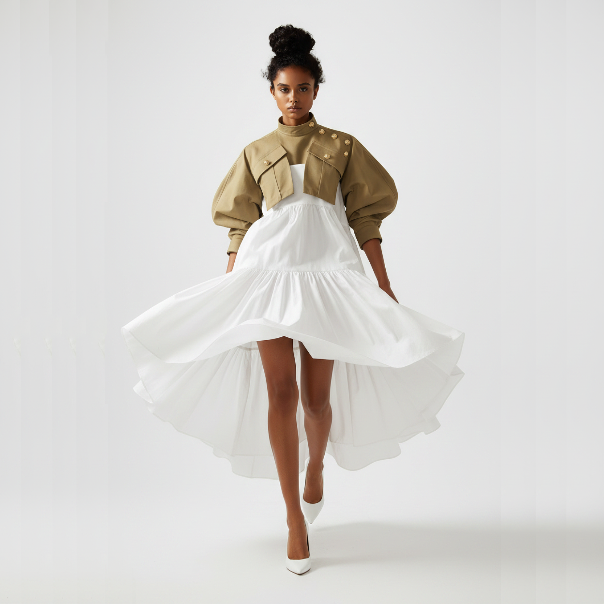 Woman wearing a beige jacket and white dress on a plain background