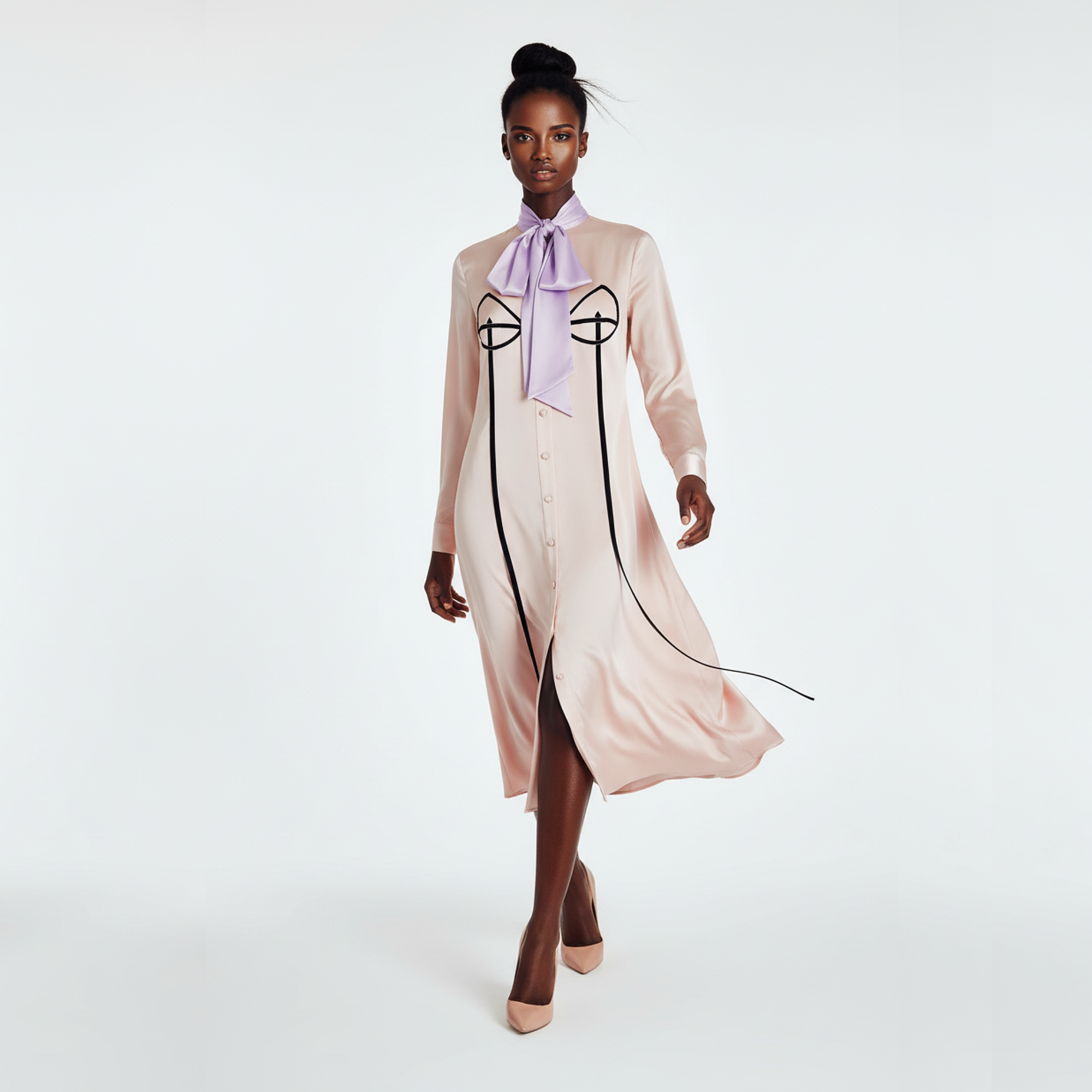 Model wearing a long, light-colored dress with a front slit and a purple scarf, standing against a white background.