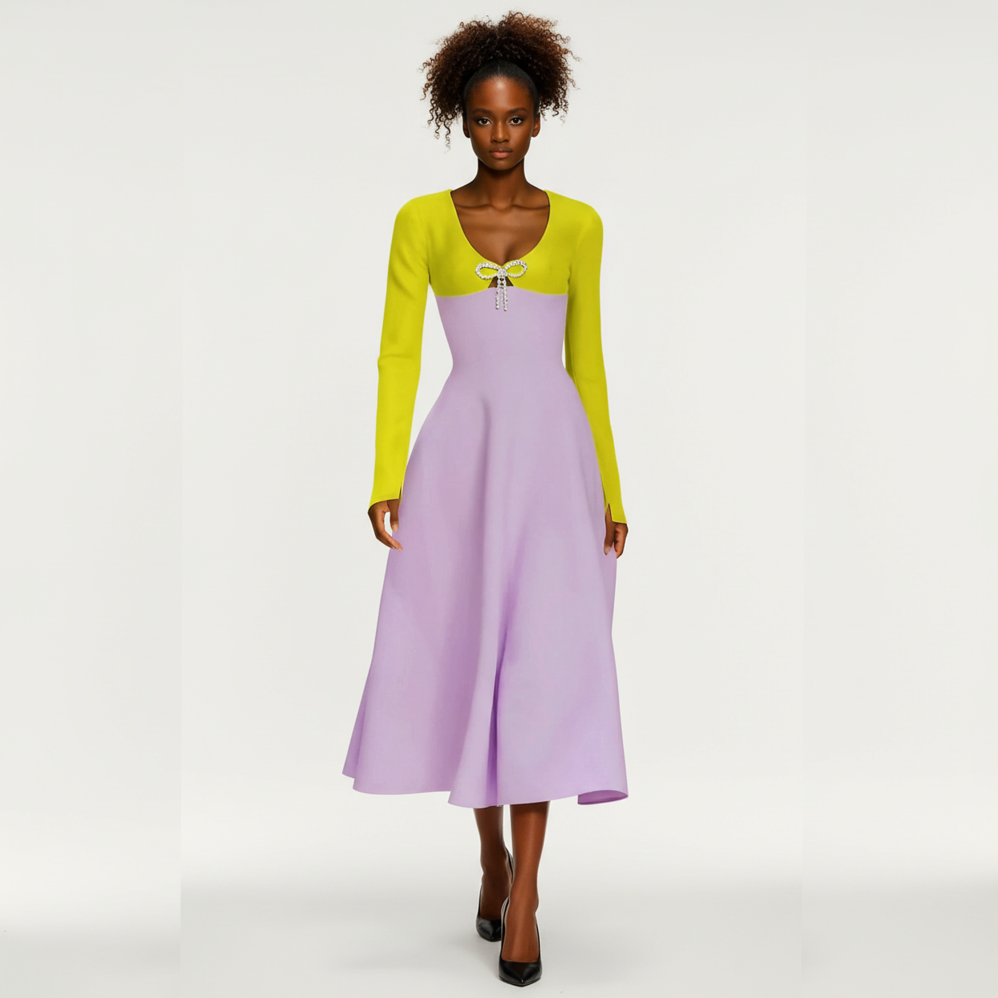 A model wearing  along with dress with a green upper bodice and long sleeves