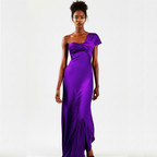 Woman wearing a purple one-shoulder gown on a white background