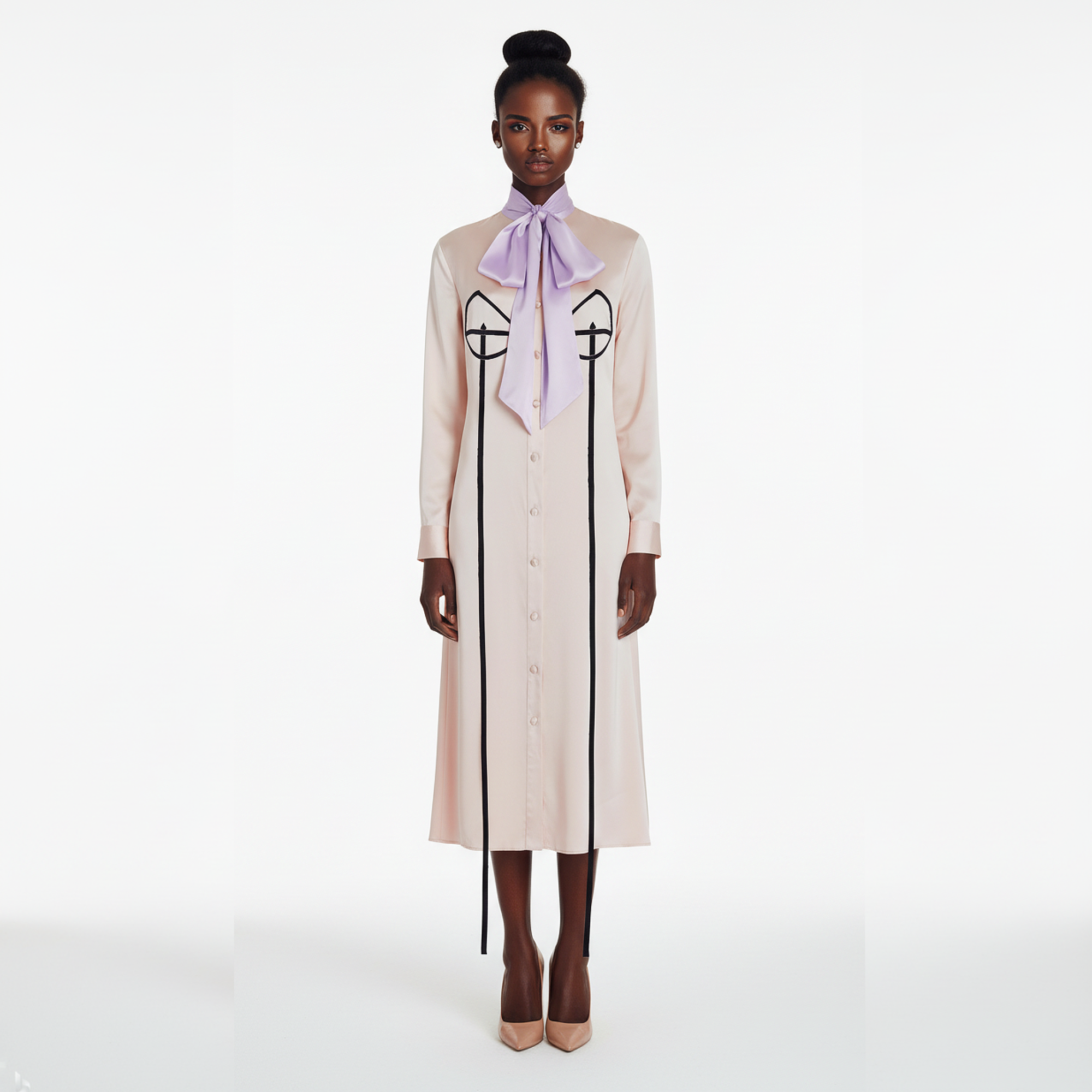 Woman wearing a long cream dress with black accents and a purple scarf on a white background