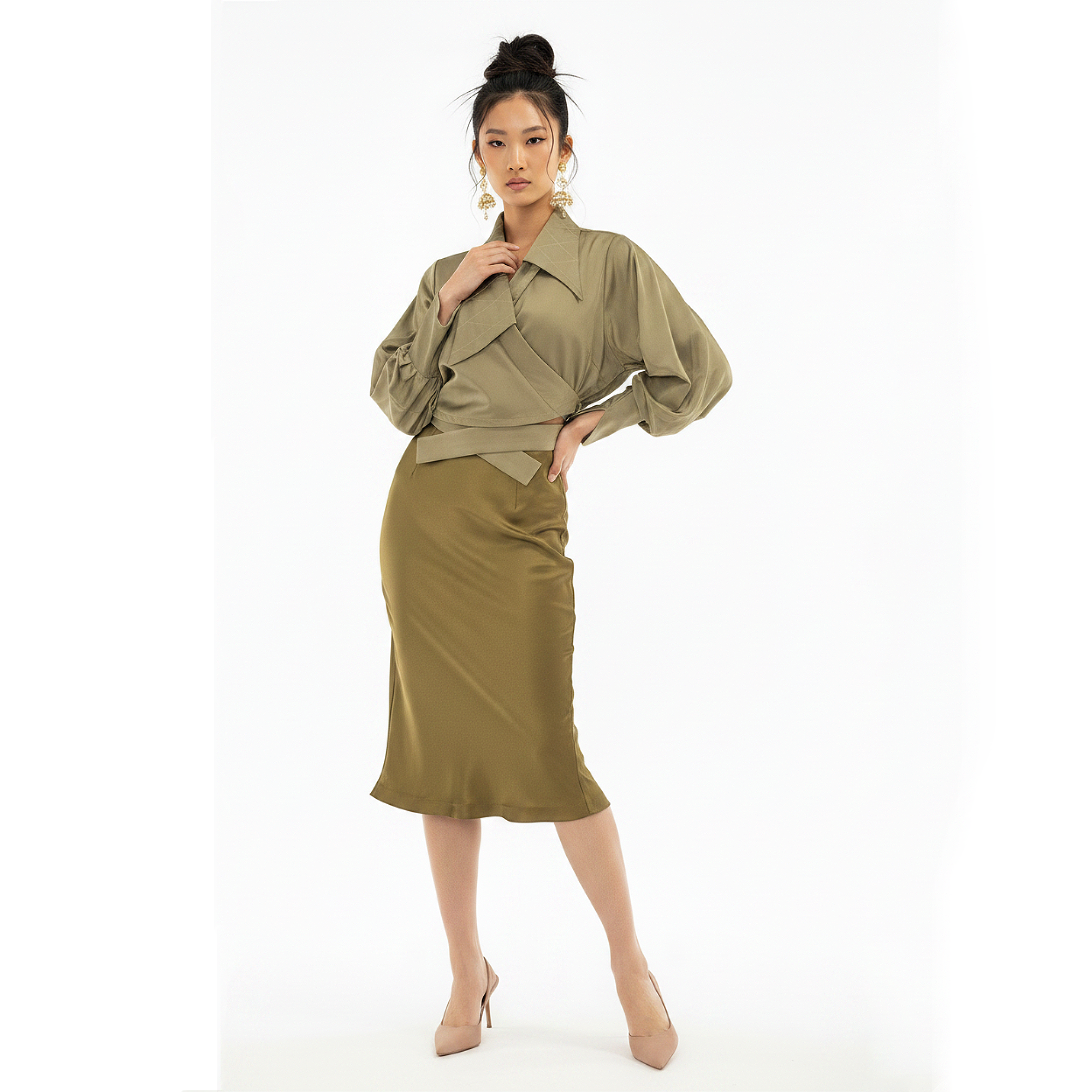Woman wearing a green outfit on a white background