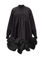 Model wearing a Maison Aria Dress