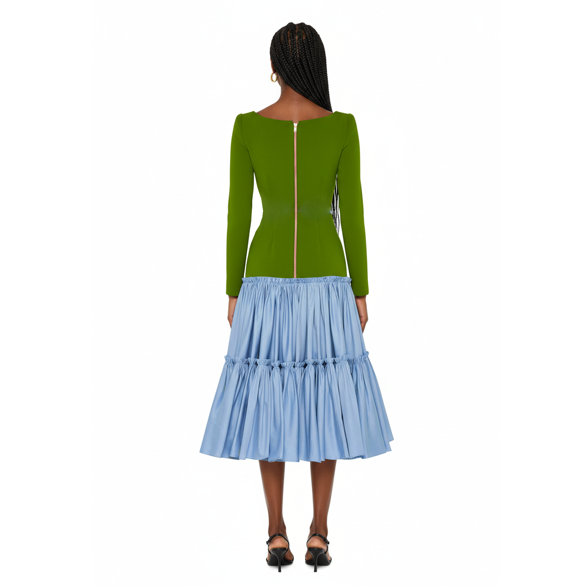 Woman wearing a green top and blue skirt on a white background