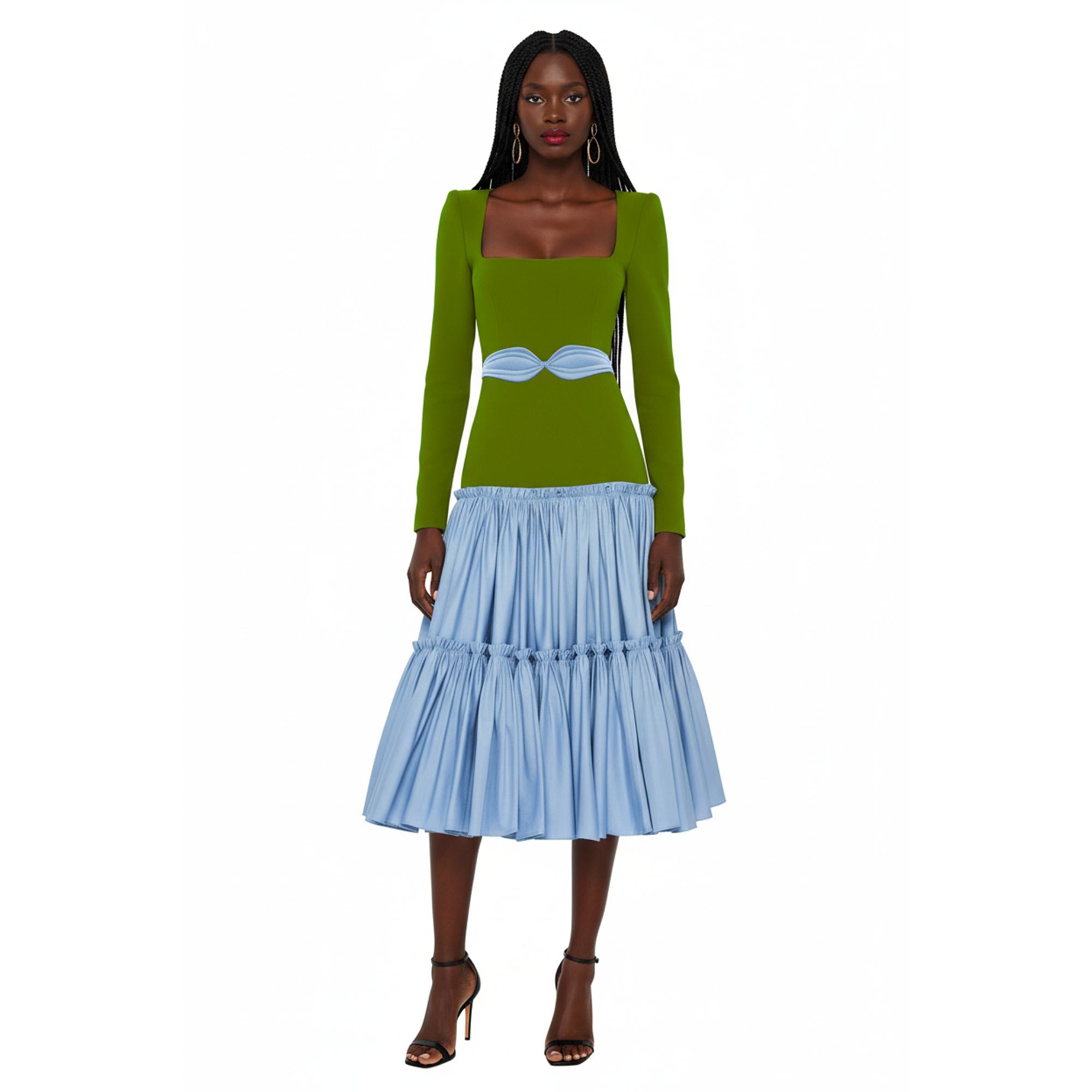 Woman wearing a green top and blue skirt on a white background