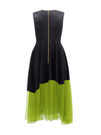 Black and green dress with a gold zipper on a white background