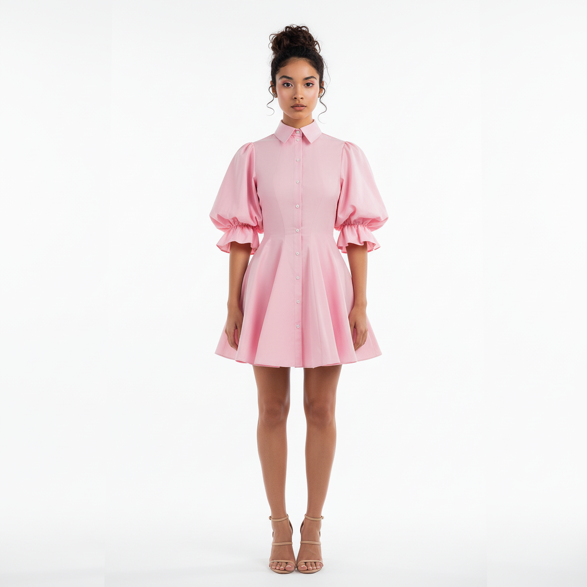 Woman wearing a pink dress on a white background