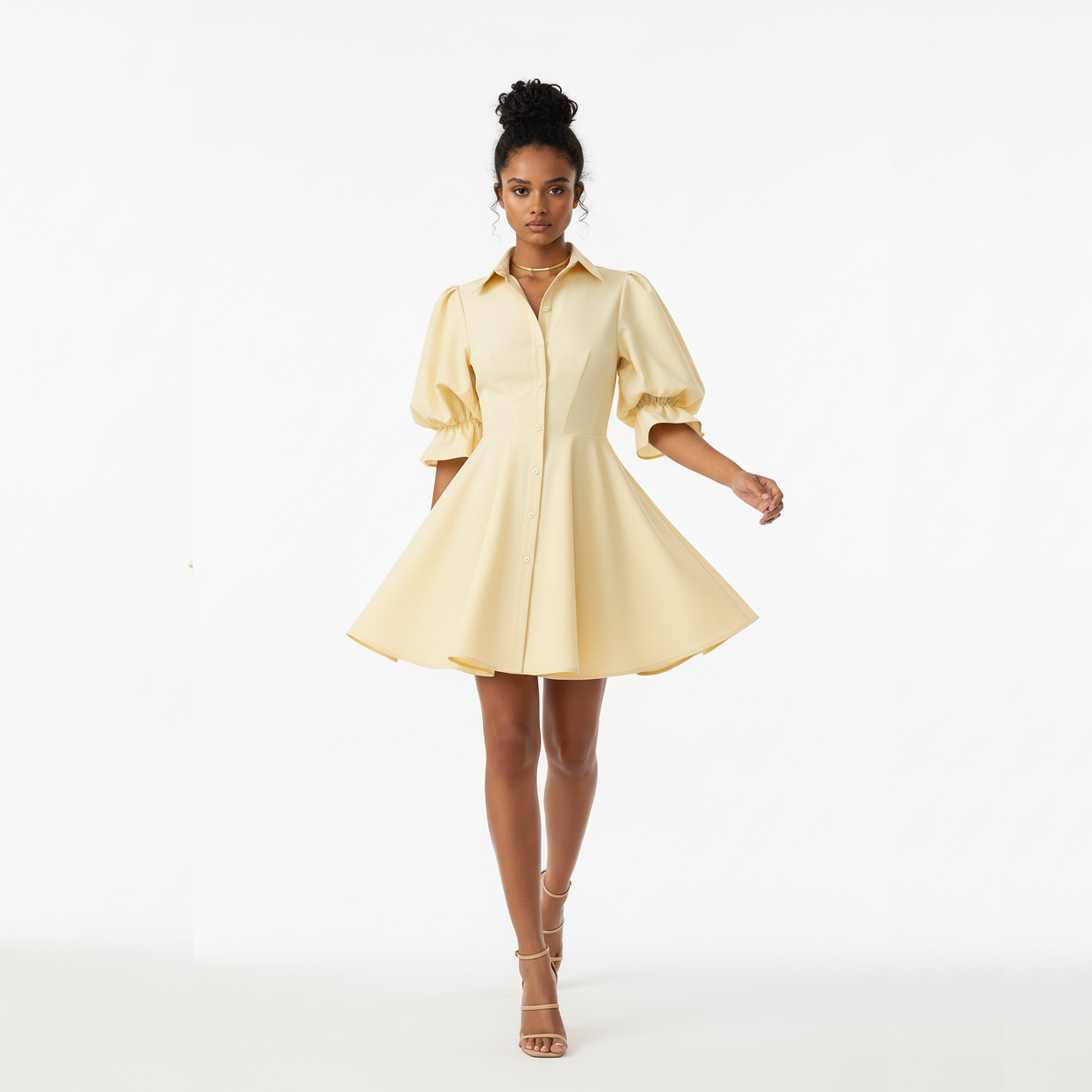 Woman wearing a light yellow dress on a white background