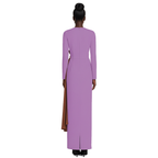Woman wearing a long purple dress with a brown slit on a white background