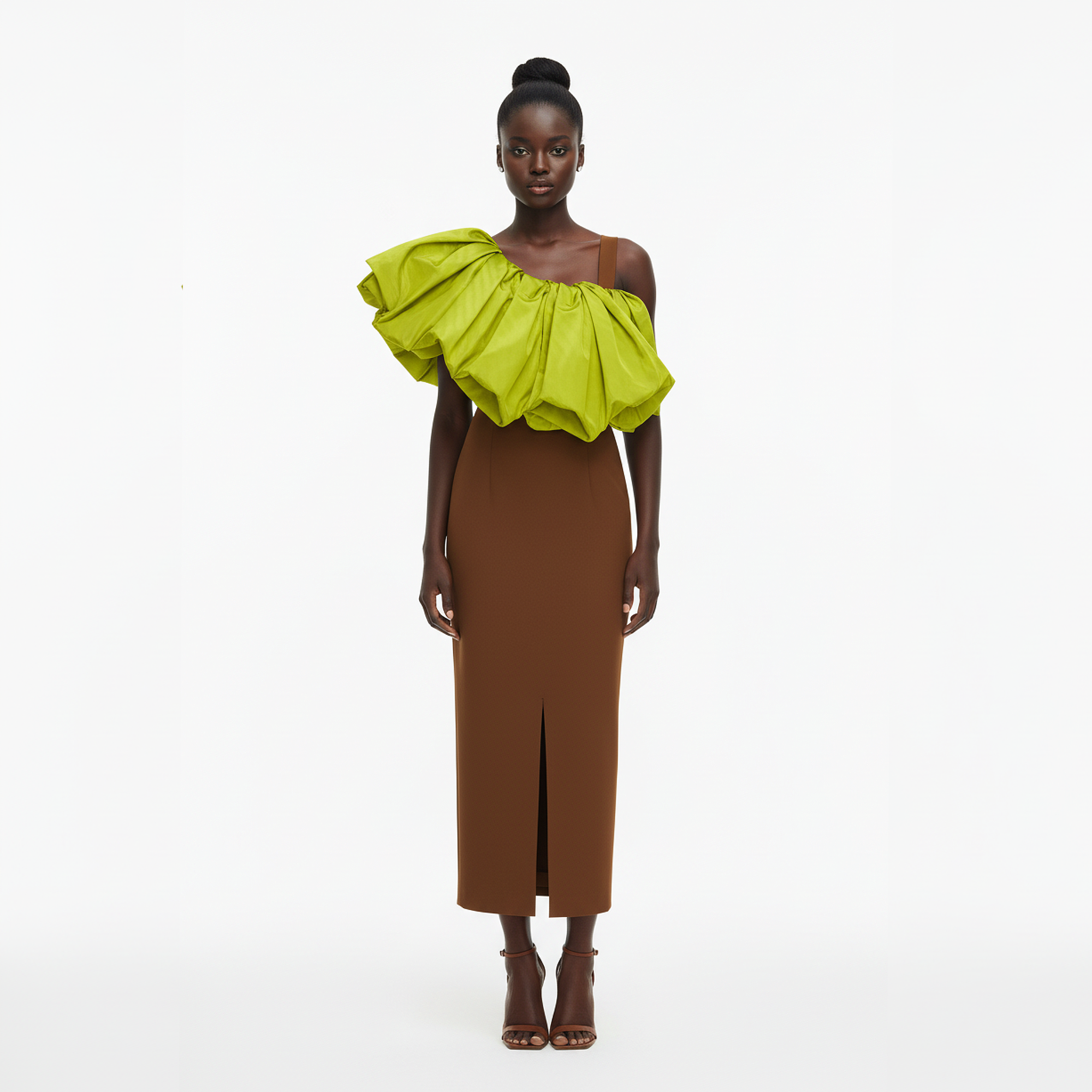 Model wearing a brown dress with a bright green ruffled top on a white background