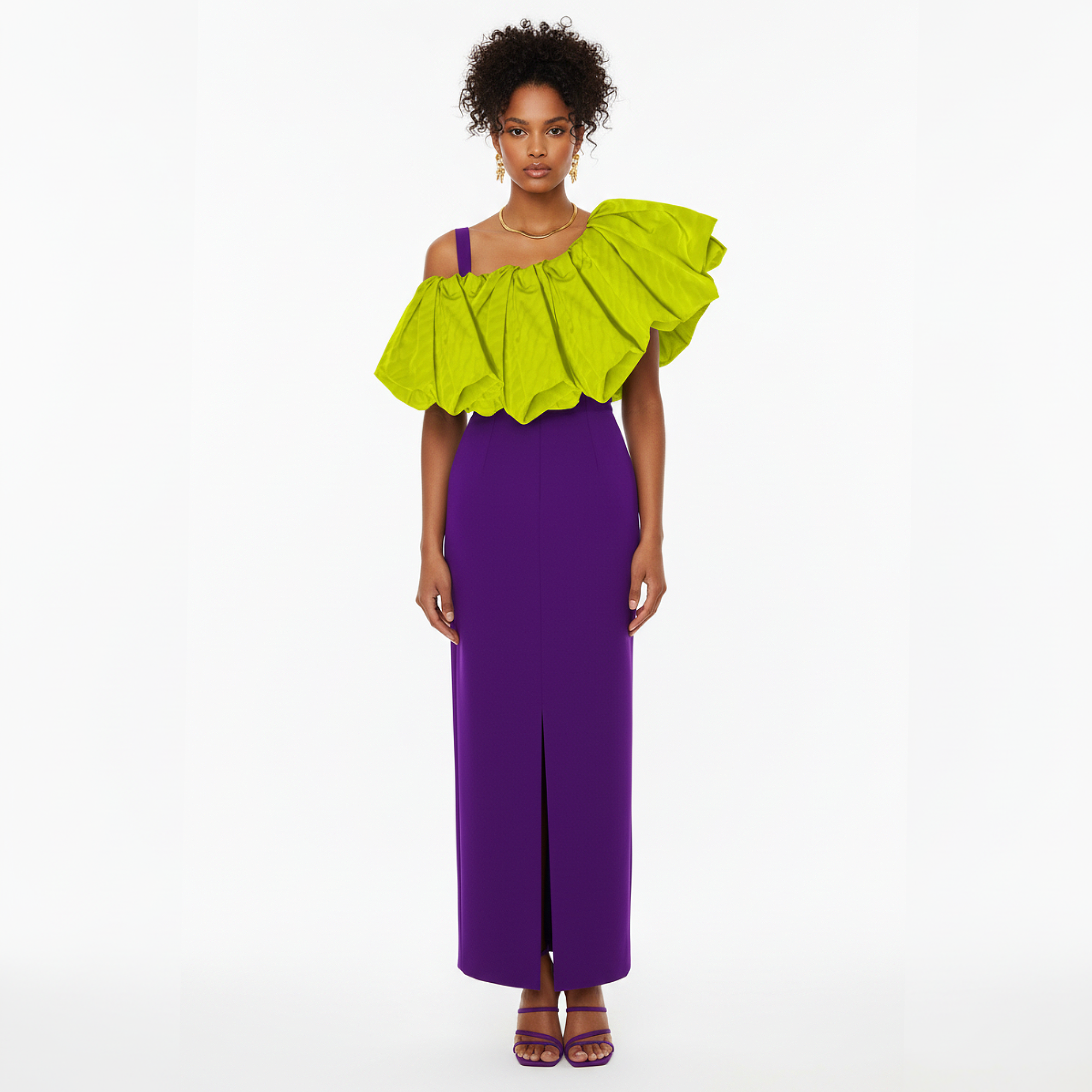 Woman wearing a bright green top and purple pants on a white background