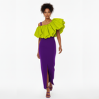 Woman wearing a purple dress with a bright green ruffled top on a white background