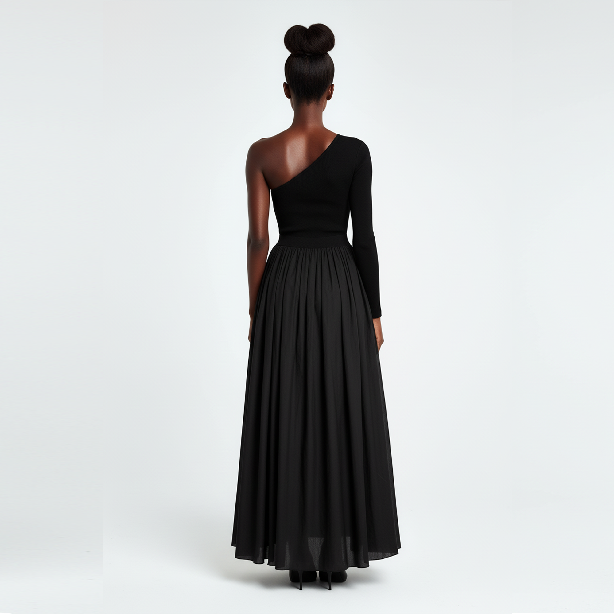 Black one-shoulder evening gown on a white background