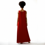 Person wearing a long red dress on a white background