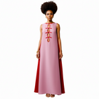 Woman wearing a pink dress with red accents on a white background