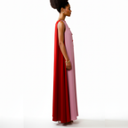 Woman wearing a pink and red dress on a white background