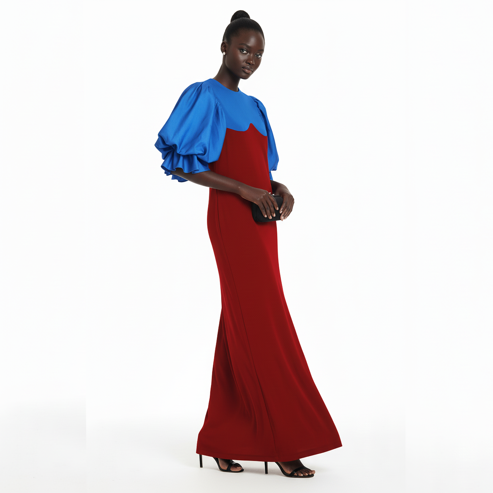 Woman wearing a red and blue dress on a white background