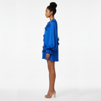 Woman wearing a blue dress on a white background