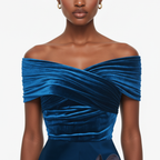 Blue off-shoulder dress worn by a model on a white background