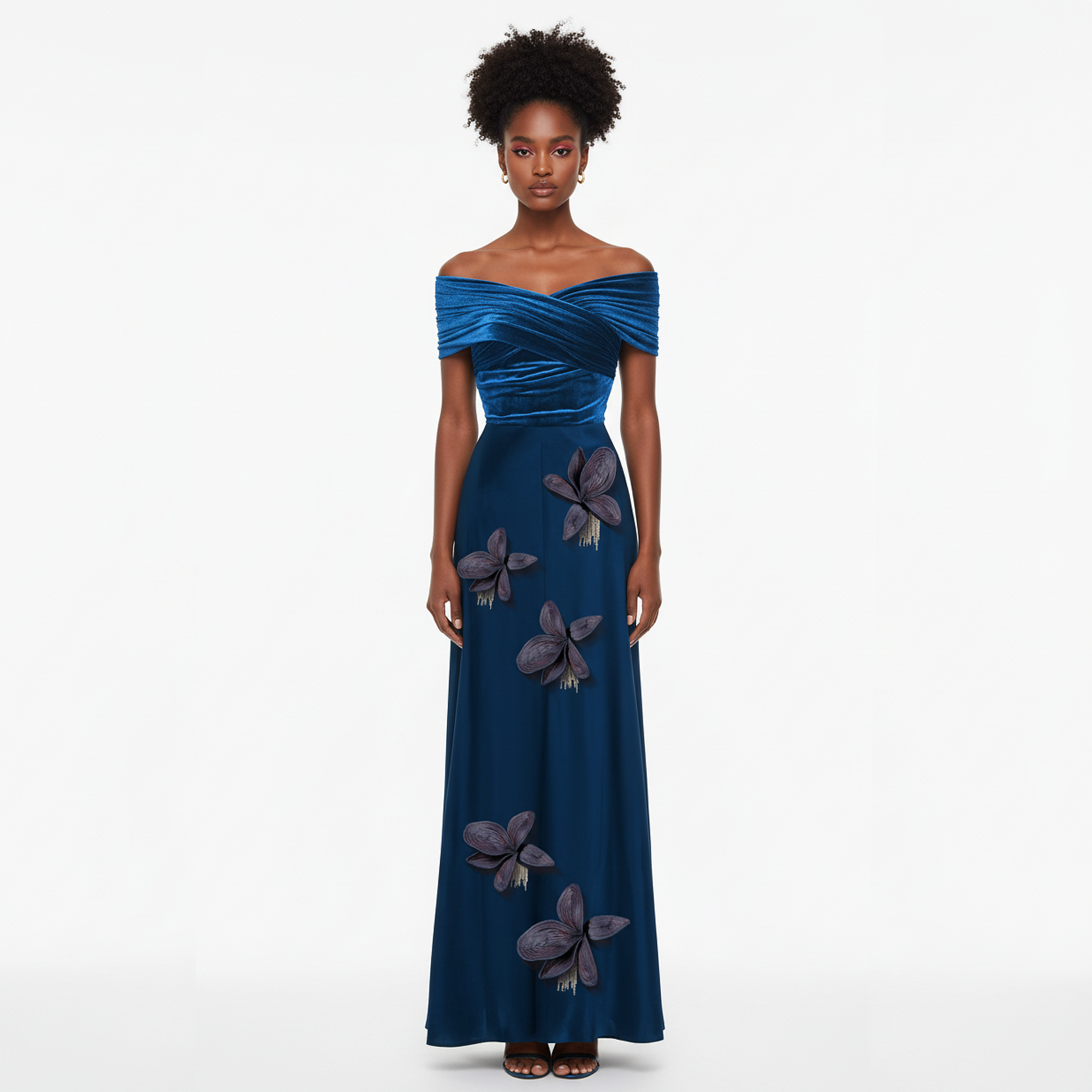 Woman wearing a blue evening gown with floral embellishments on a white background