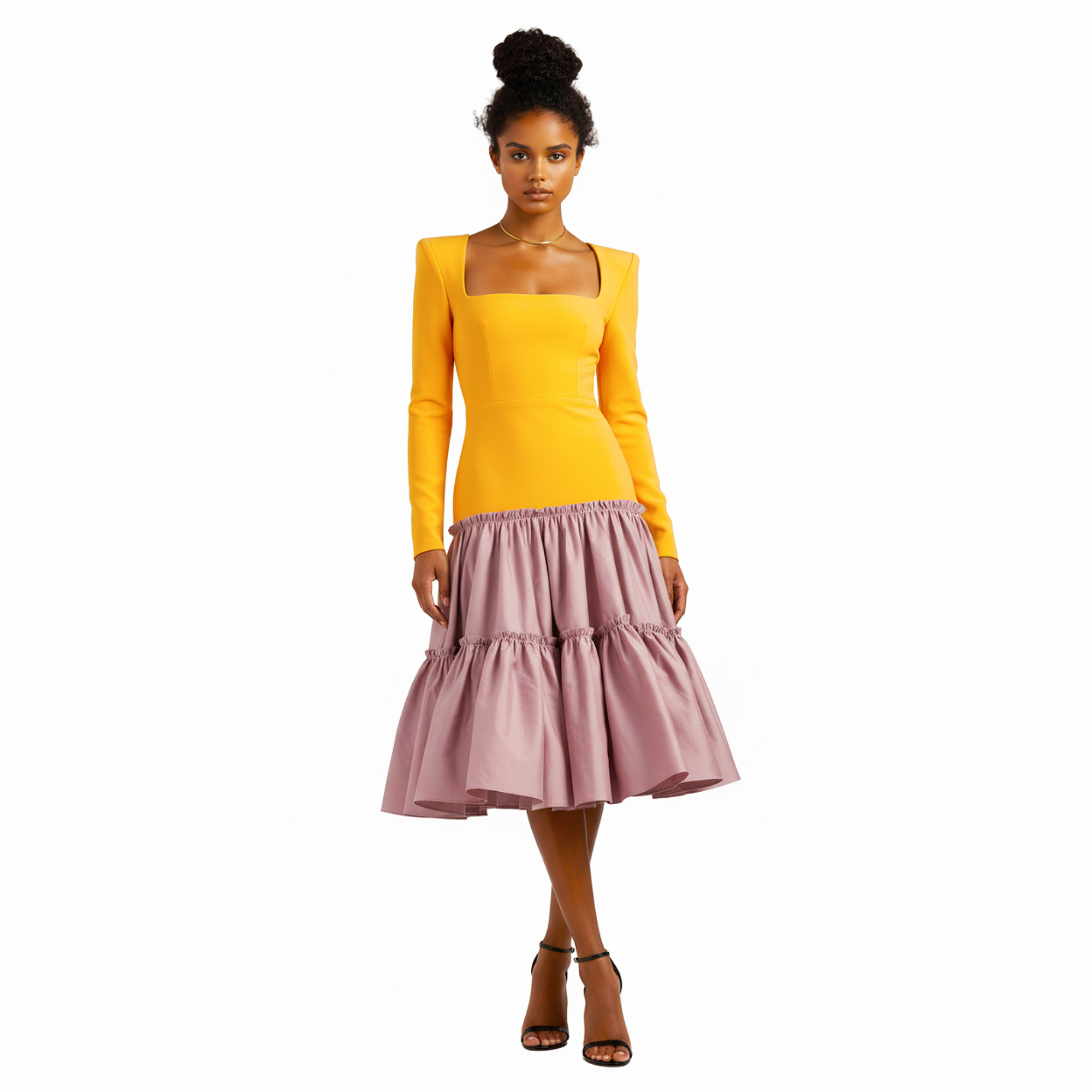 Woman wearing a yellow top and pink skirt on a white background